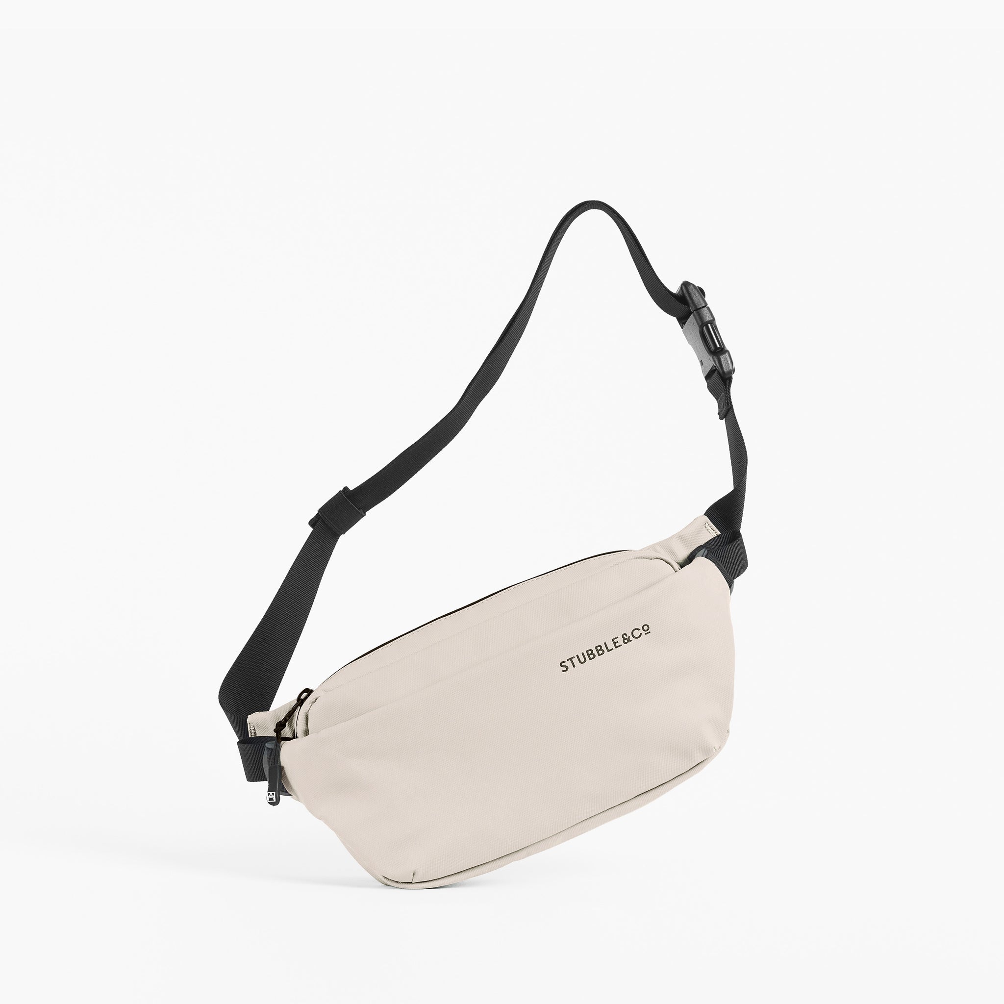 A studio shot of a Sand Crossbody with the strap up