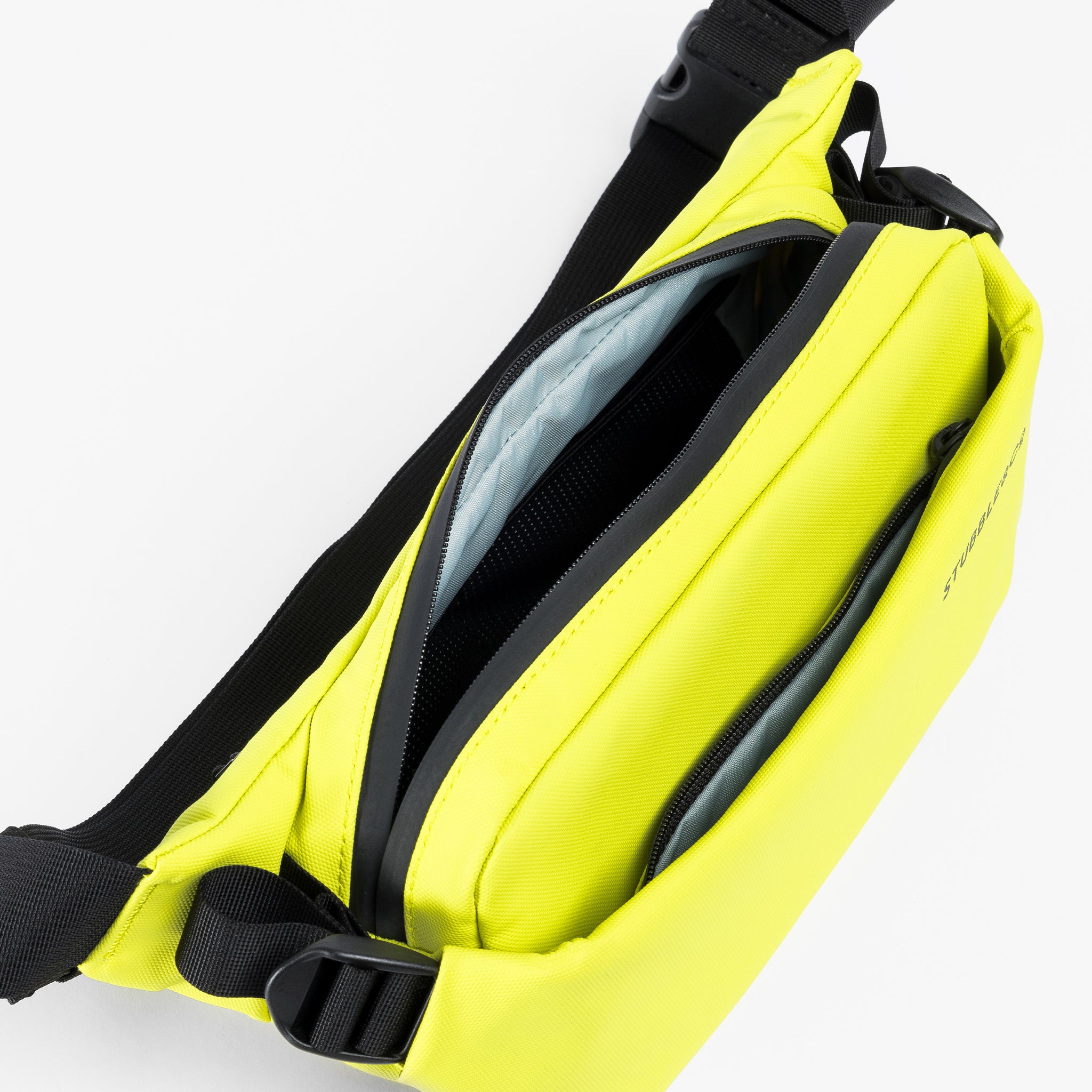 A studio shot of the interior and multiple compartments on the Volt Crossbody