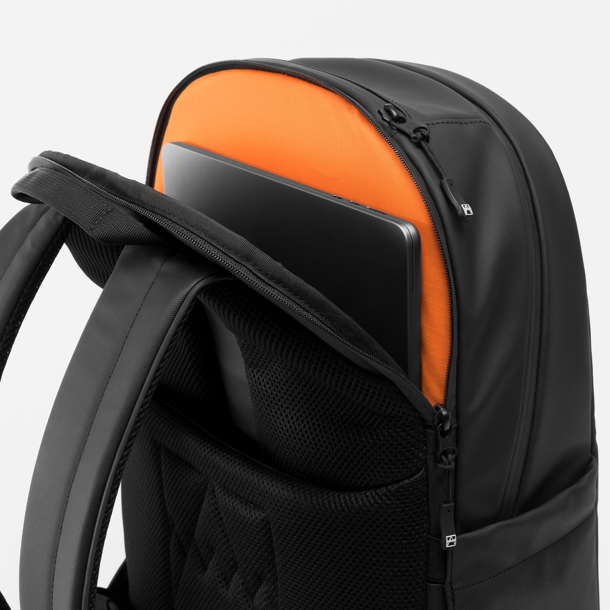 A studio shot of the laptop compartment and breathable back panel on the Everyday Backpack 20L in All Black