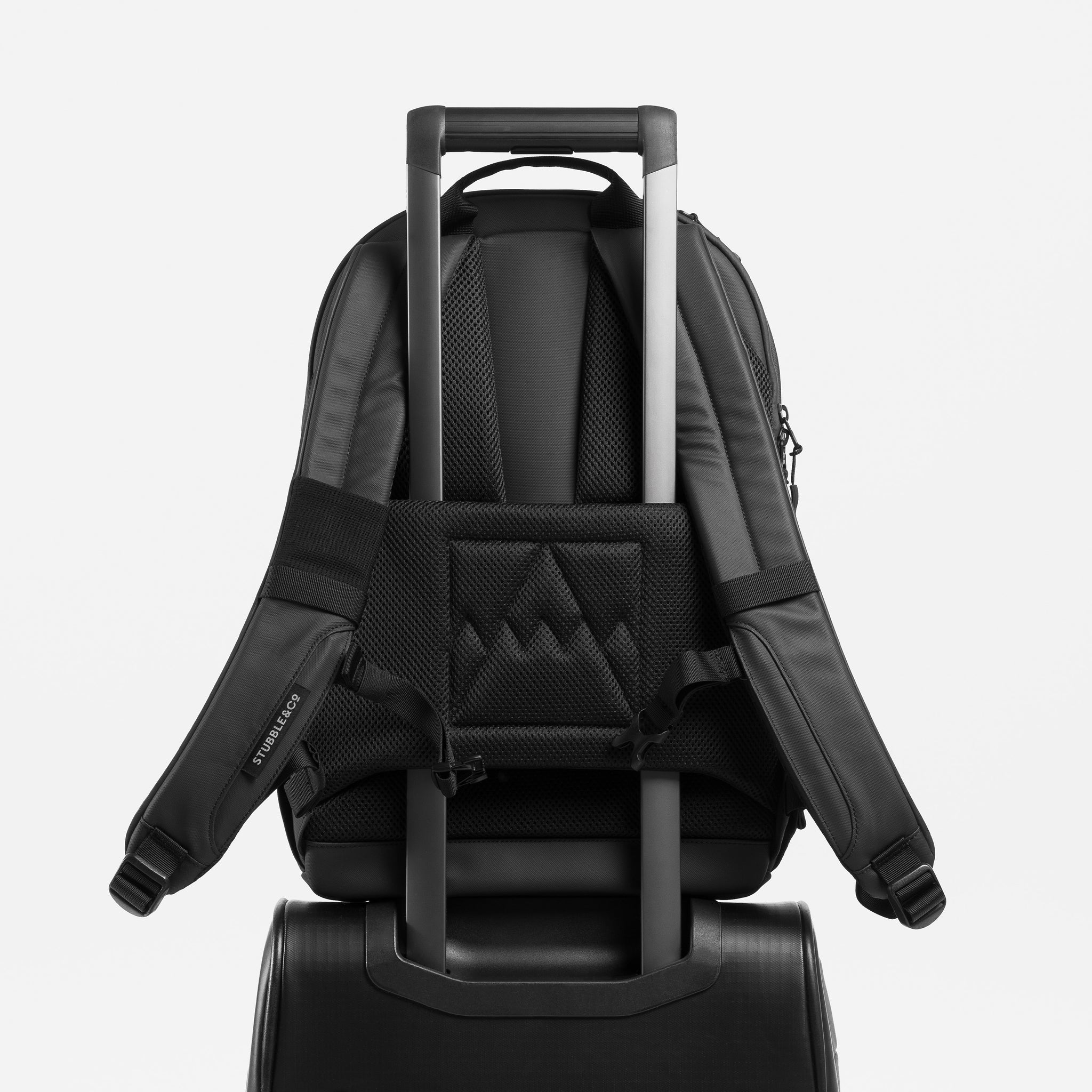 A studio shot of the breathable back panel and trolley sleeve on the Everyday Backpack 20L in All Black