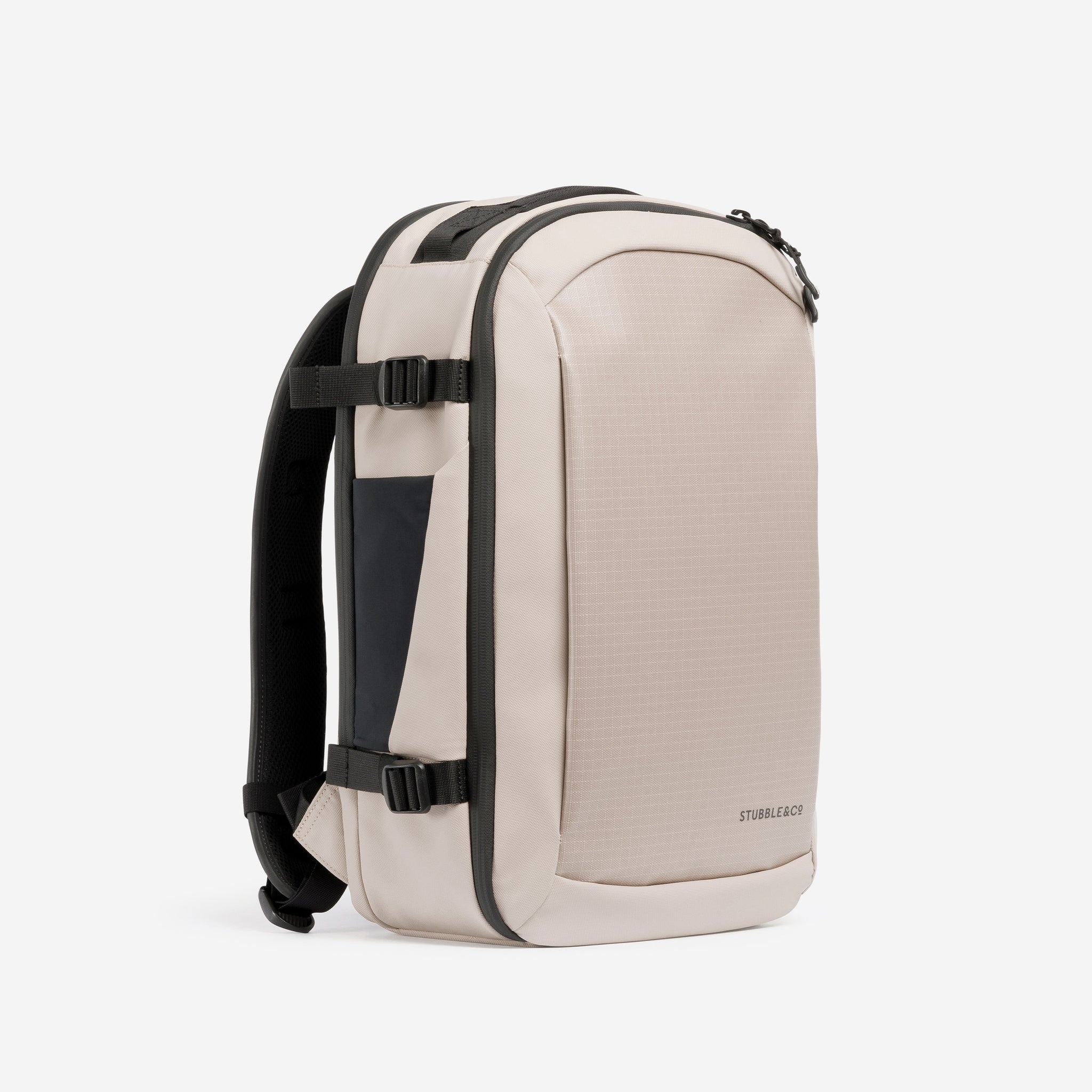 A studio shot of the front and side of the Hybrid Backpack 20L in Sand