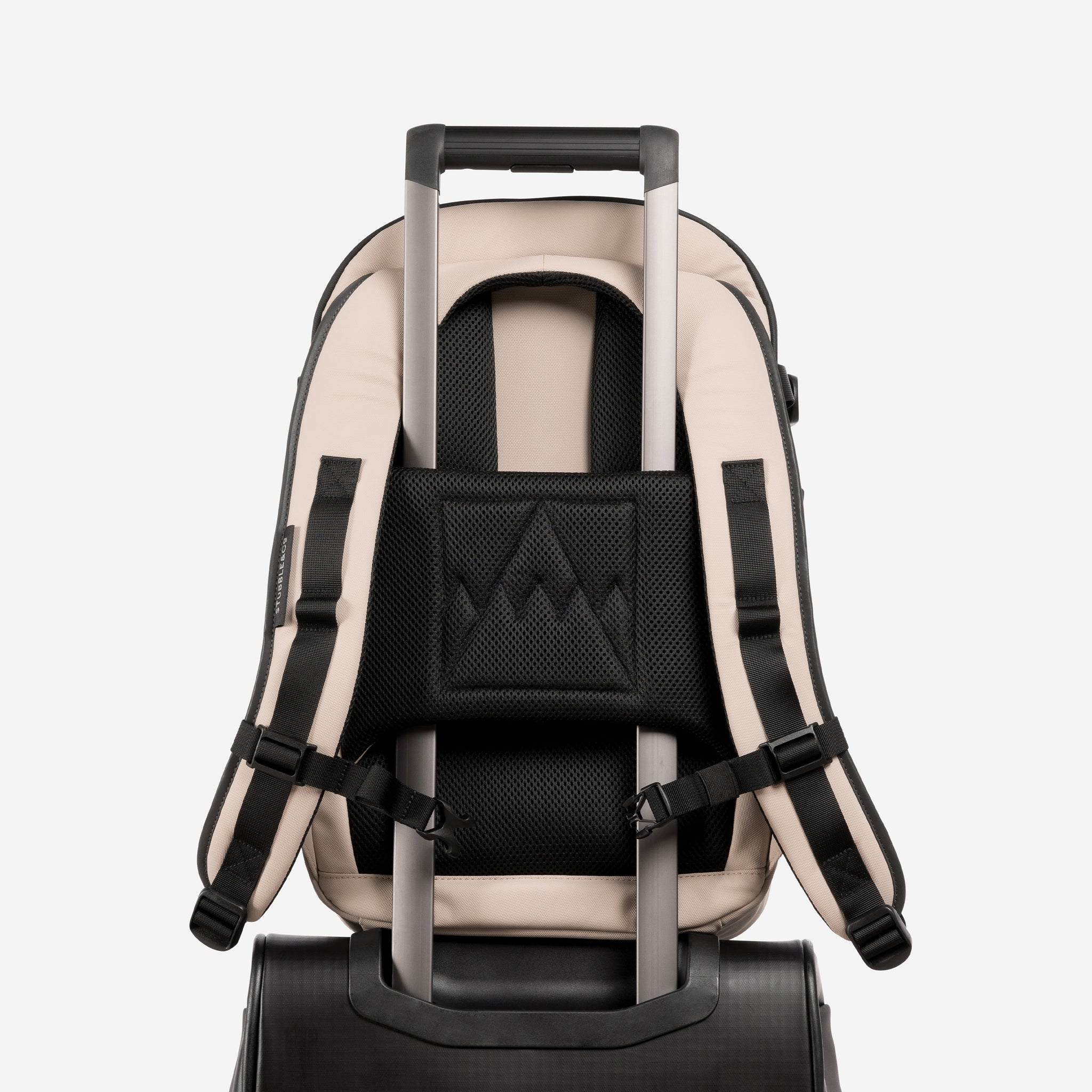 A studio shot of the trolley sleeve on a Hybrid Backpack 20L in Sand