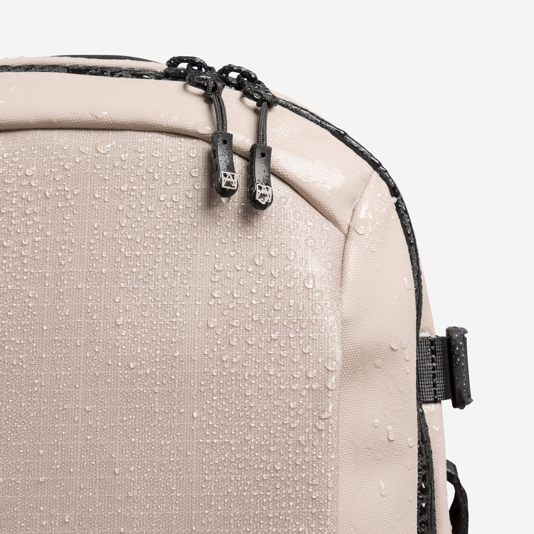 A studio shot of the waterproof materials on a Hybrid Backpack 20L in Sand