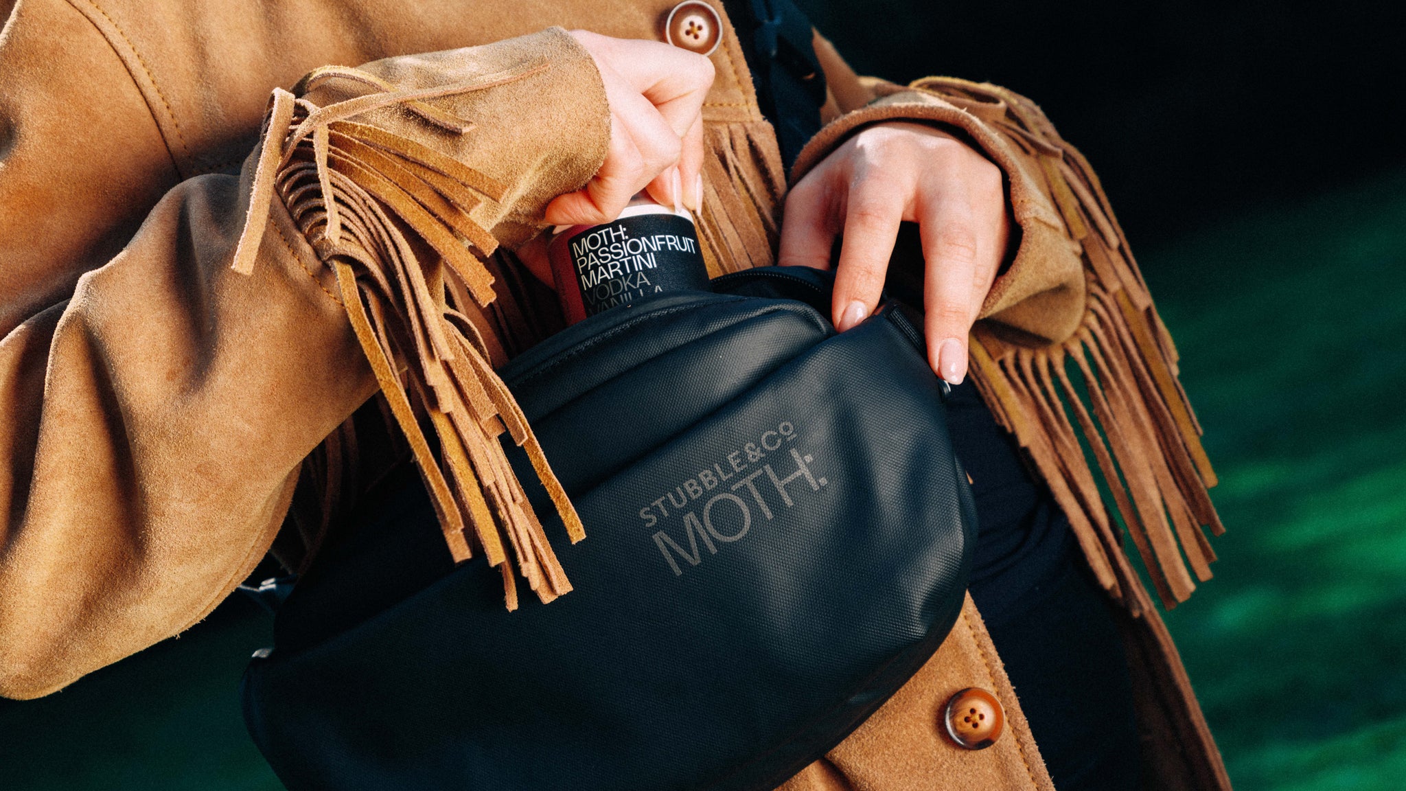a woman wearing the MOTH co-branded crossbody