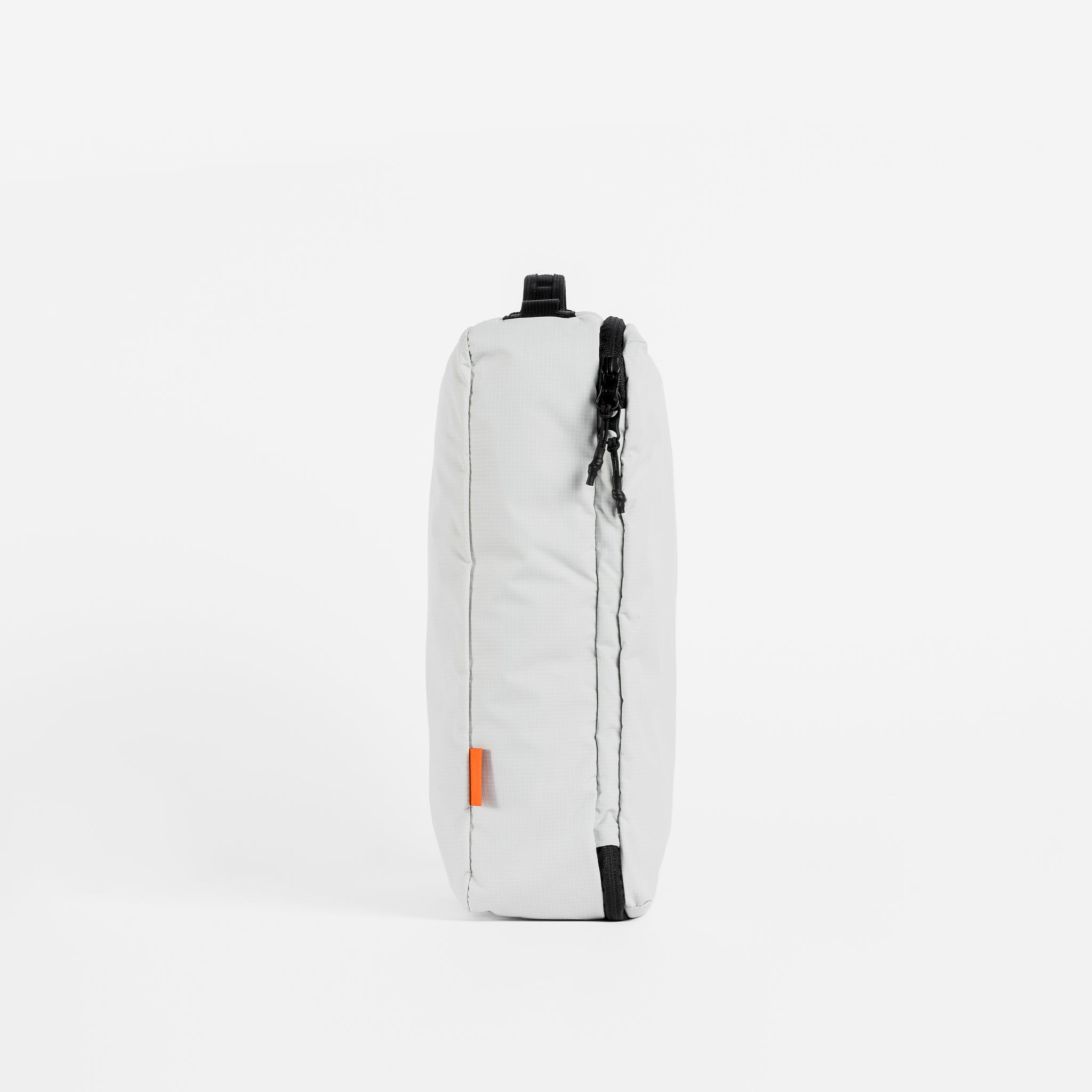 A studio shot of the side of an Off-White packing cube 11l