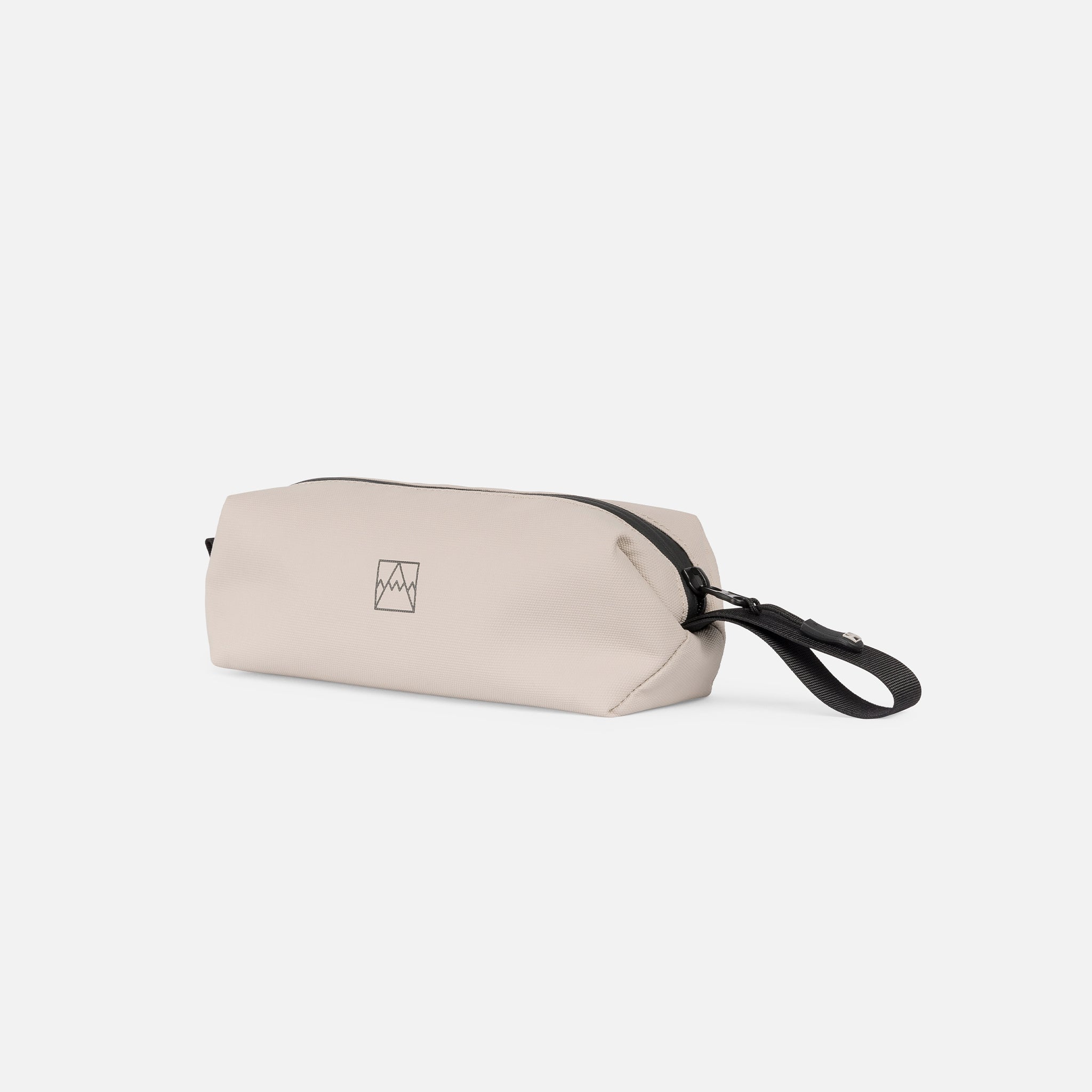 A studio shot of the side and loop handle of the pencil case in Sand