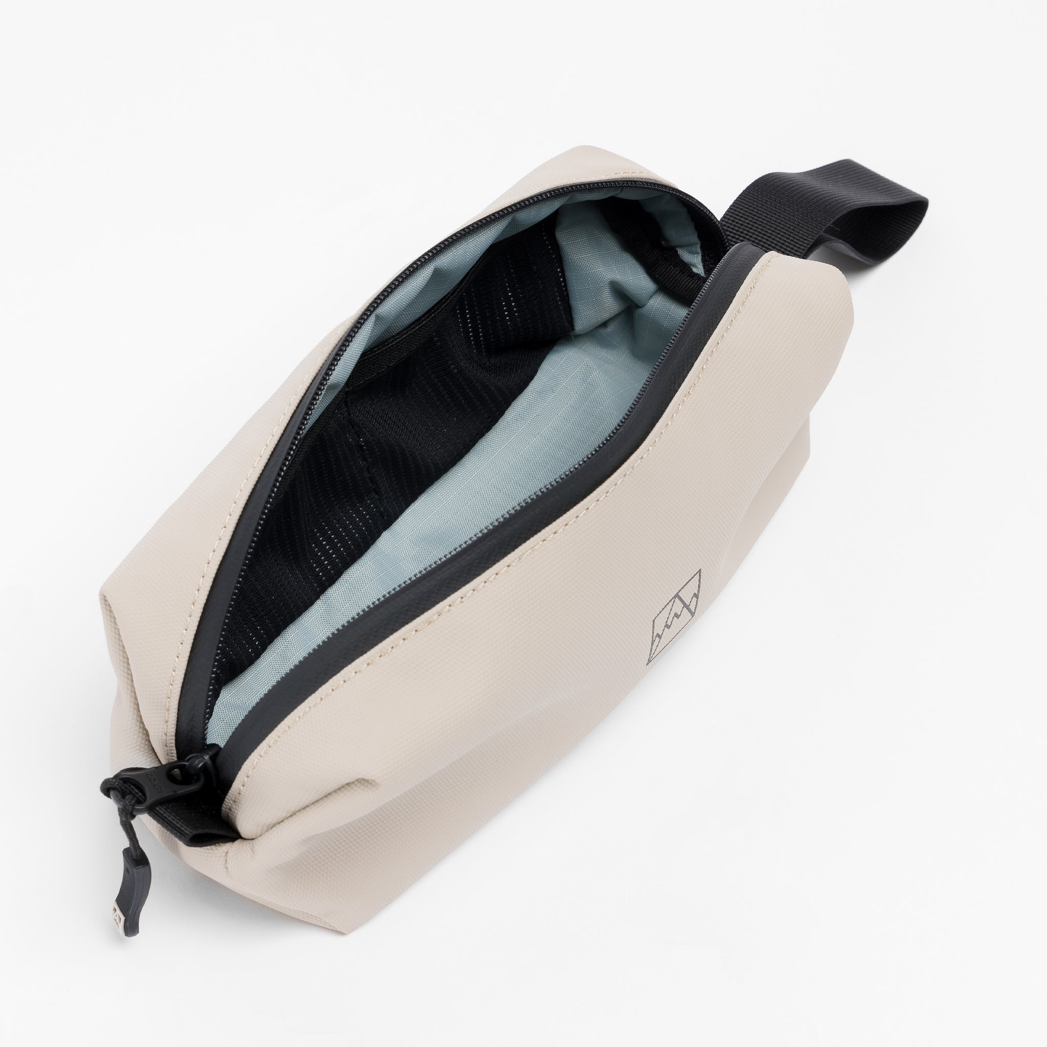 A studio shot of the interior of the Pencil Case in Sand