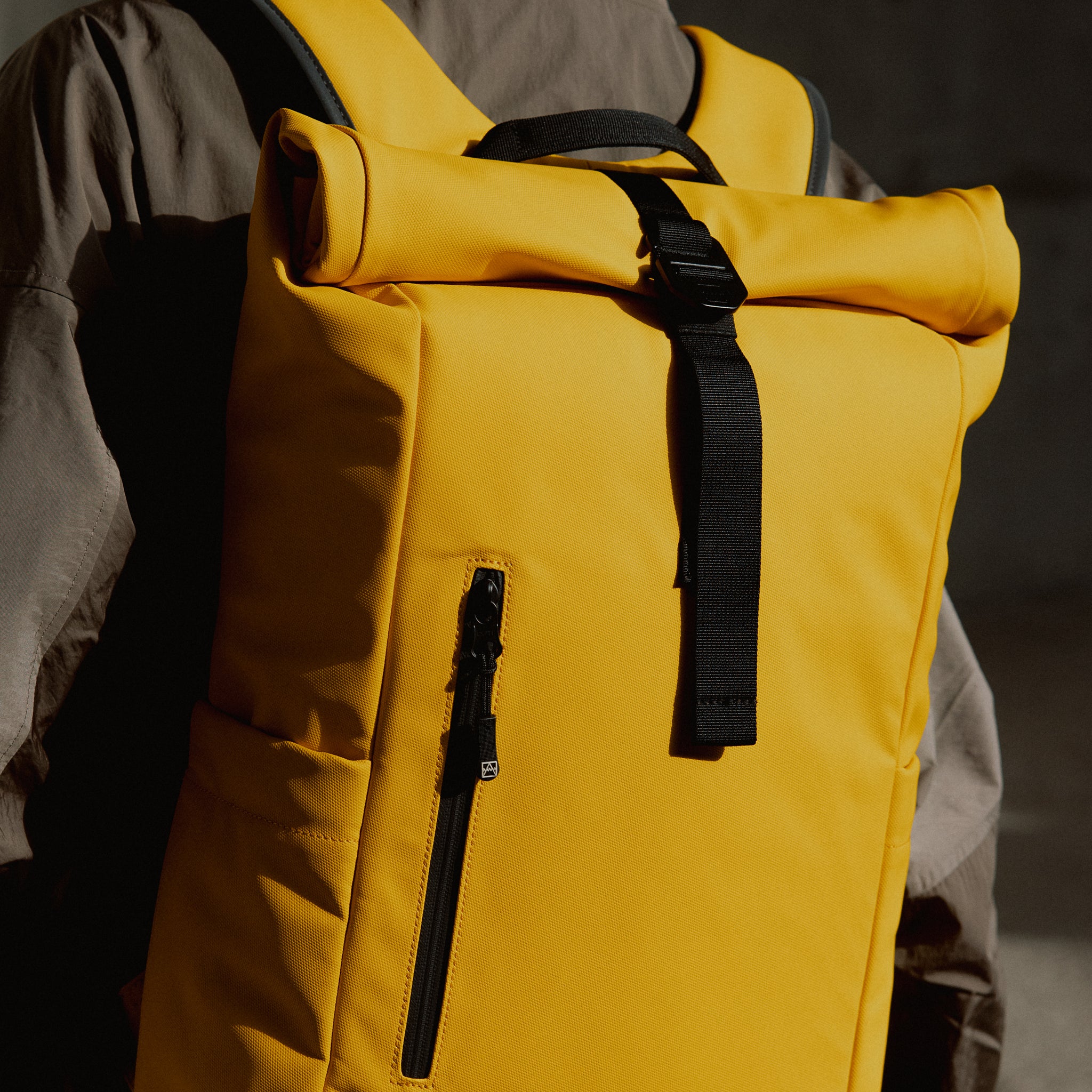 a close up shot of a Yellow roll top 15l