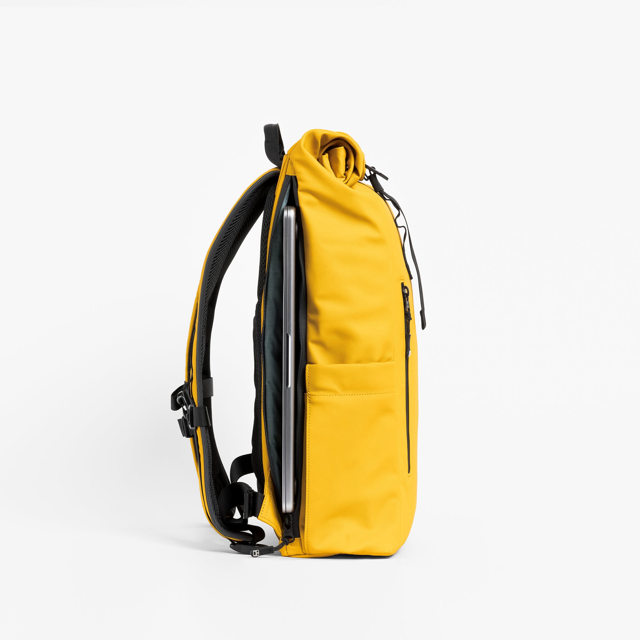 a srudio shot of the laptop compartment on a Yellow roll top 15l