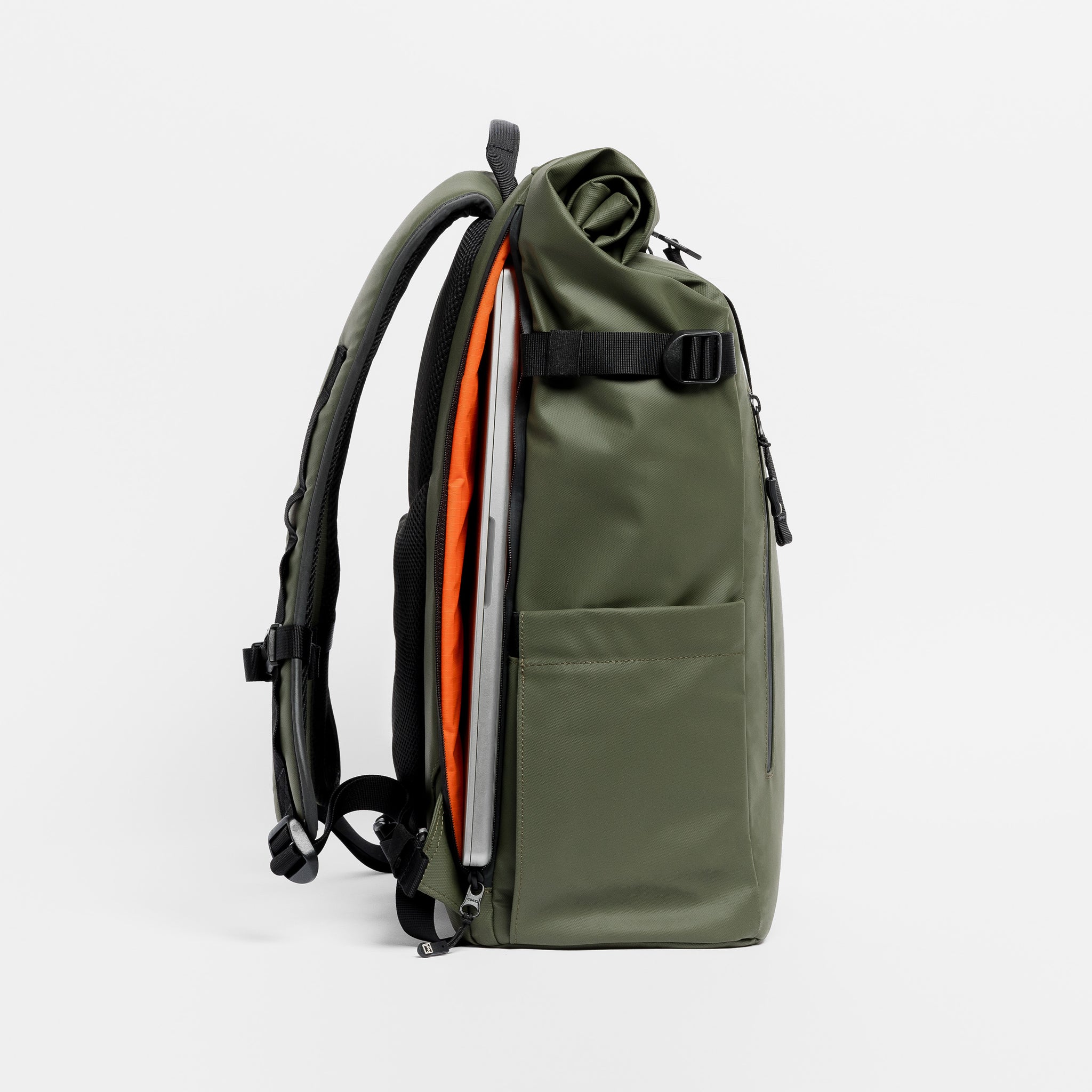 A  studio shot of the Roll Top 30l in Urban Green showing the laptop compartment