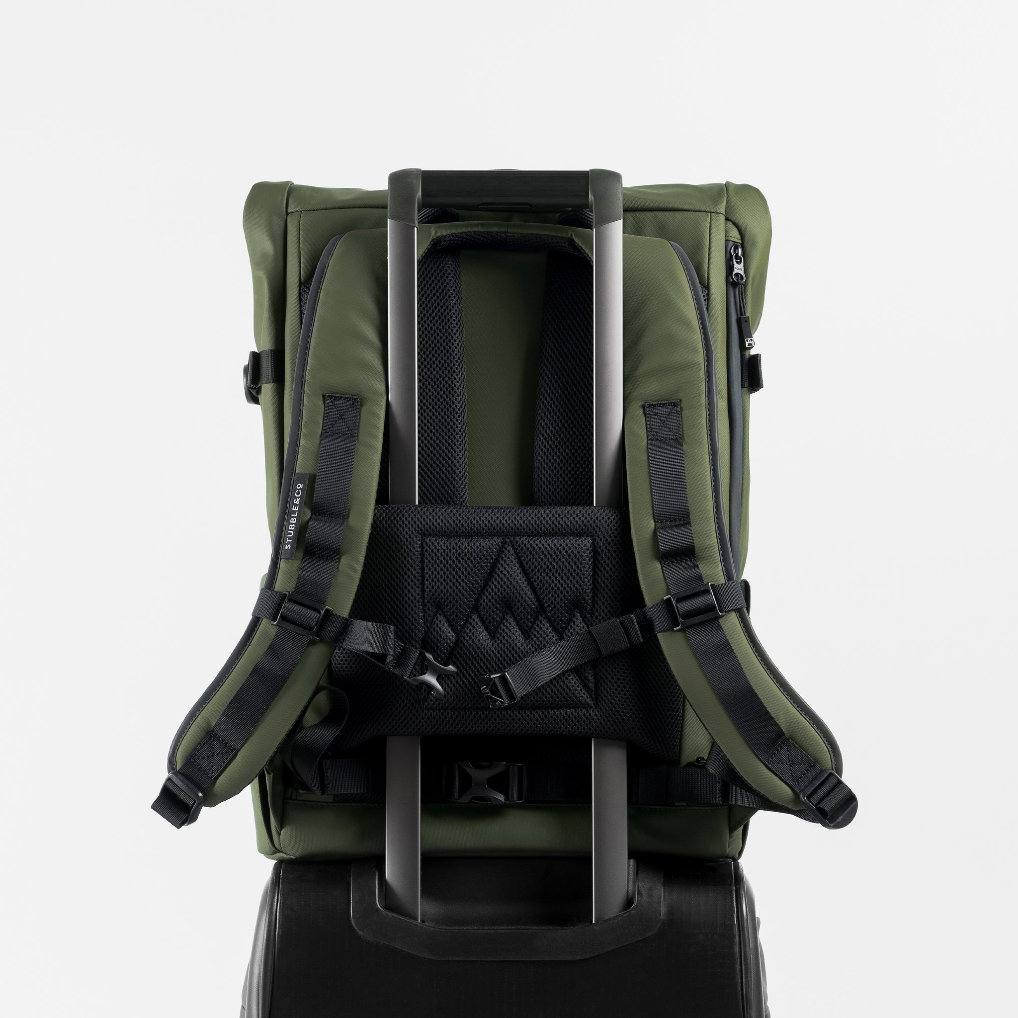 A  studio shot of the Roll Top 30l in Urban Green showing the trolley sleeve