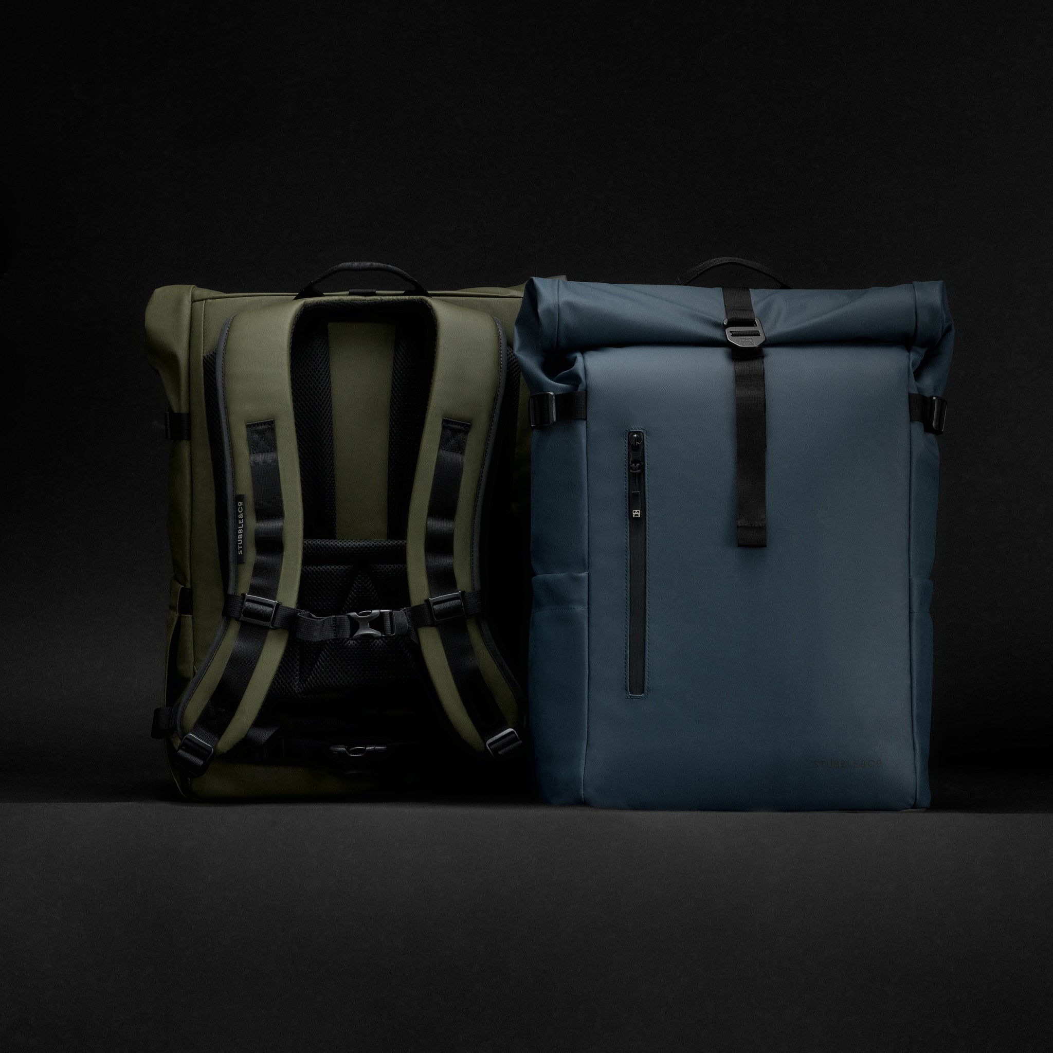 A studio shot showing the front of the blue and back panel of the Urban Green Roll Top 30L