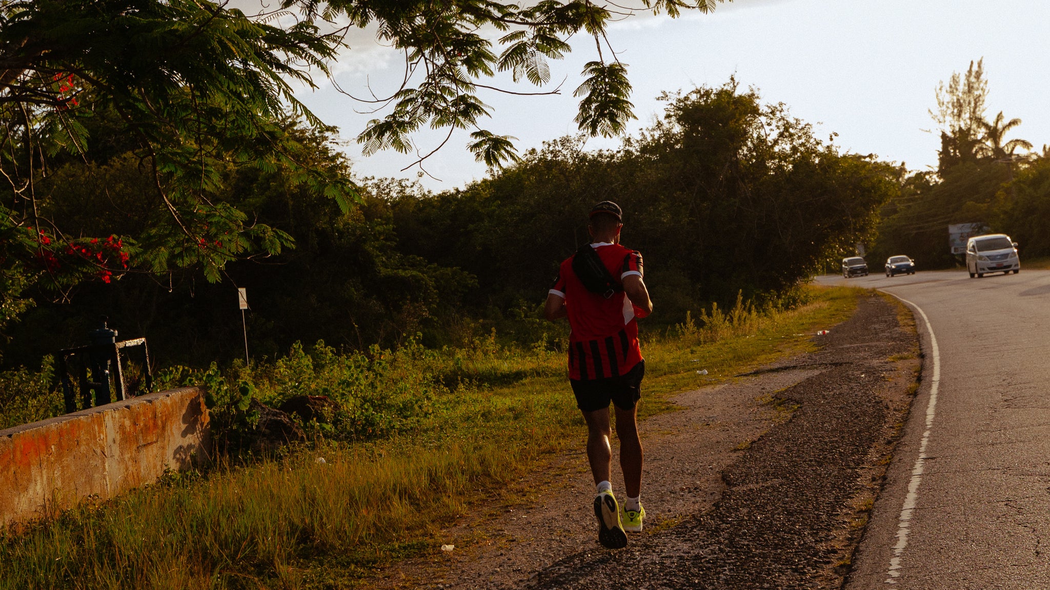 A man running down the road in Jamaica