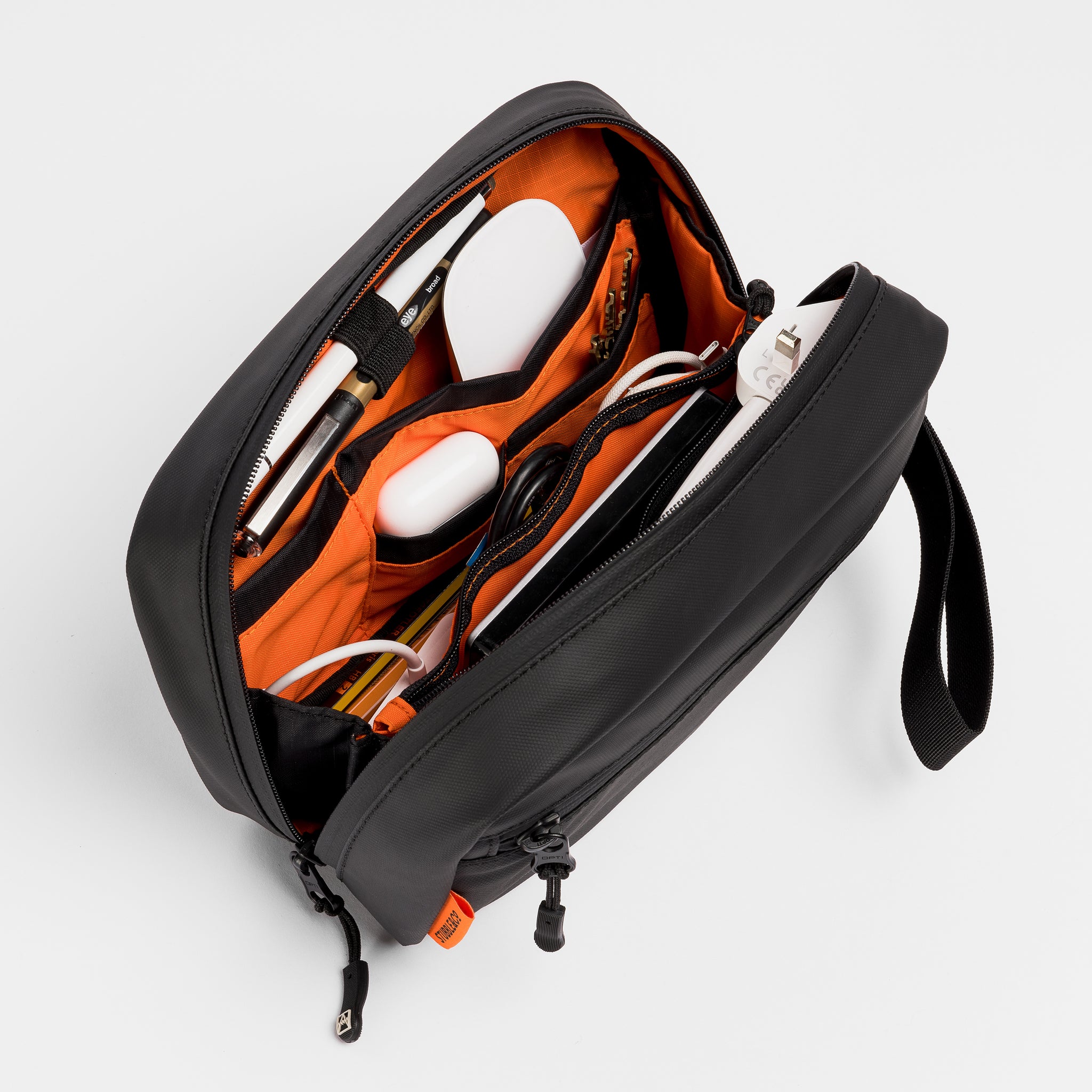 A studio shot of the packed interior of the tech bag in All Black