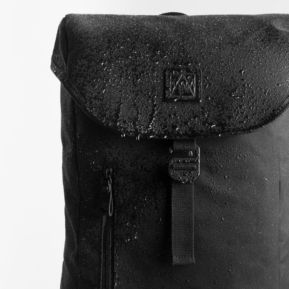 Backpack with water droplets showing it is waterproof