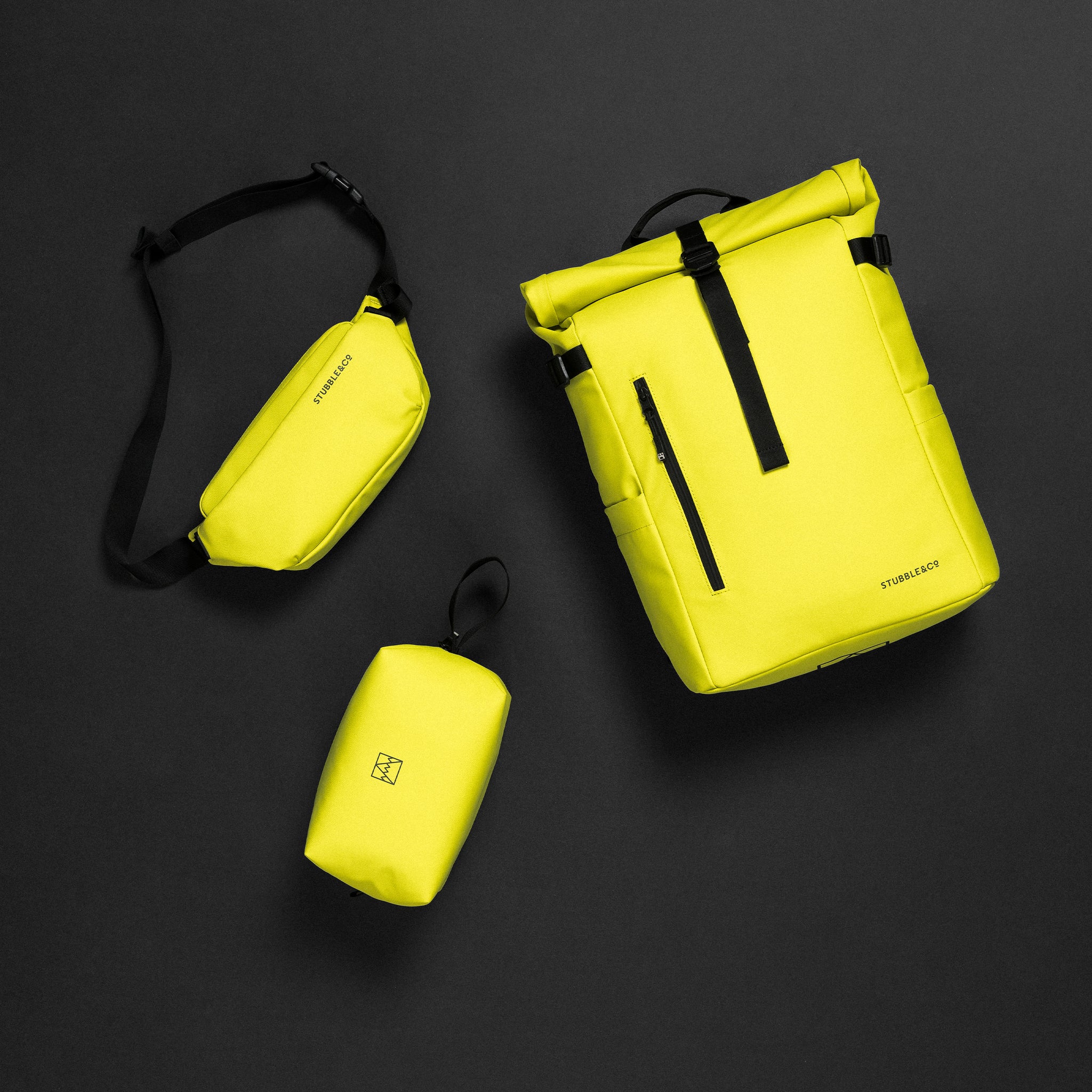 A studio creative of the entire limited edition Volt collection, including the Roll Top 20l, Crossbody and Beer Bag