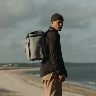 Side view of a man wearing The Cooler in Concrete.