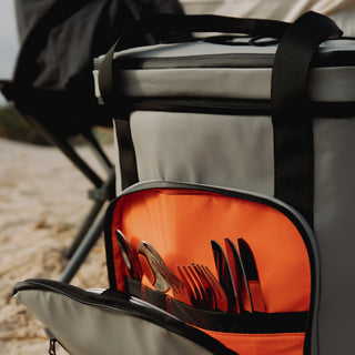 Cooler backpack in grey with side pocket open with cutlery