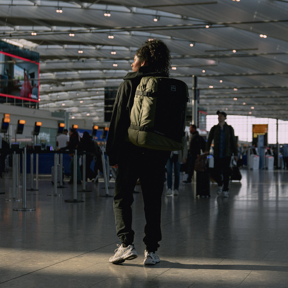 women wearing Adventure Bag in Urban Green at an airport