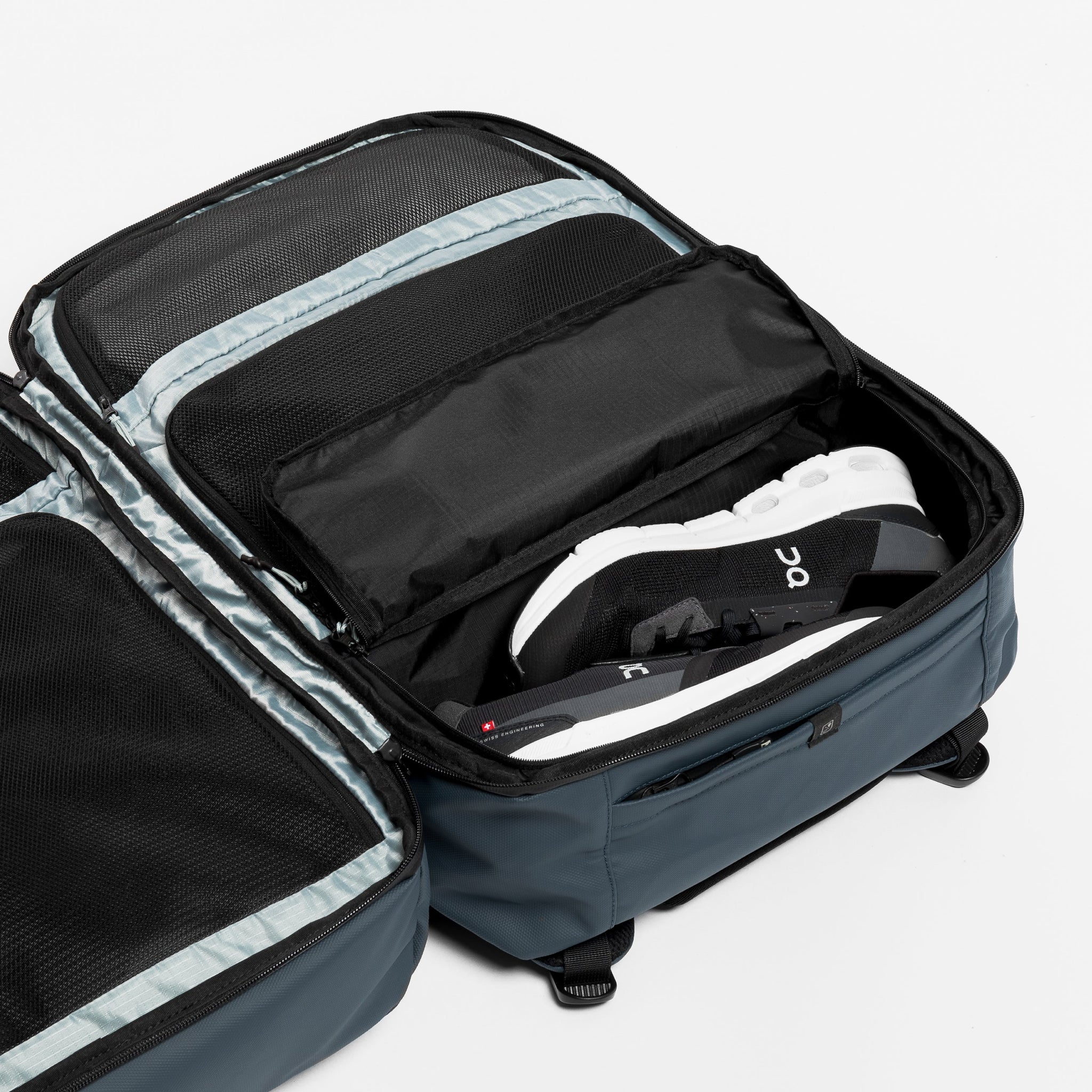 Adventure Bag in Tasmin Blue with clam shell inside view