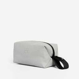 The Wash Bag in Concrete at a side angle