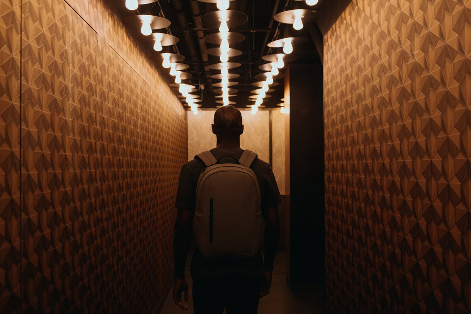 Man in dark hallway with the Everyday Backpack