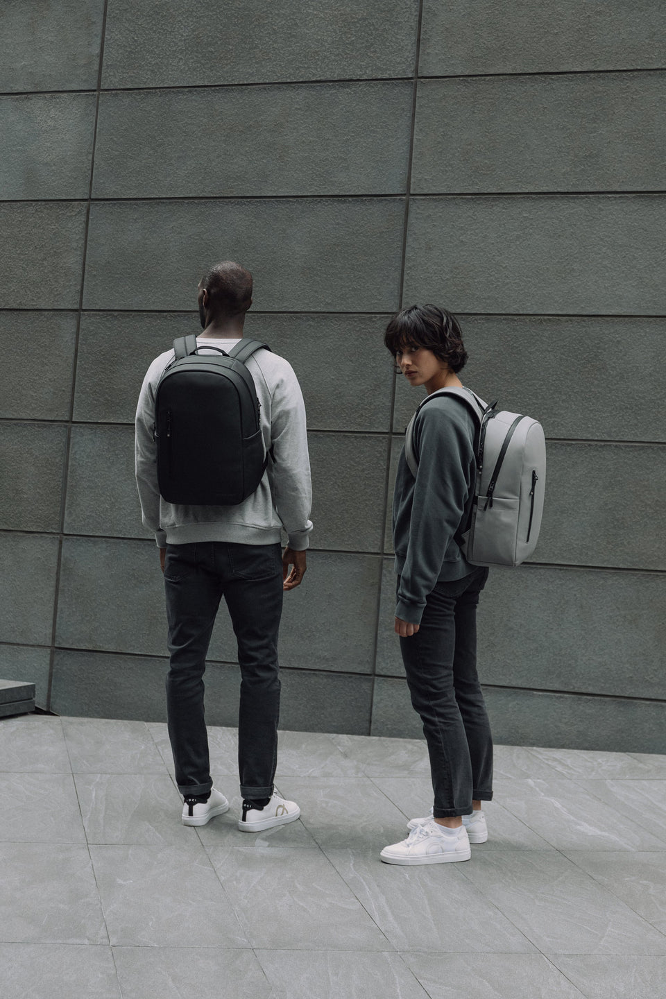 Man and women with the Everyday Backpack