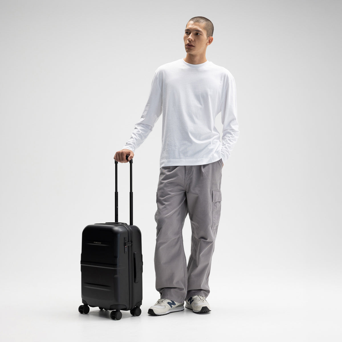 A male model with the Hardshell 40L in All Black