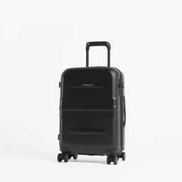 A black hard-shell spinner suitcase with an extended telescoping handle, standing upright on a clean white studio background. [All variants]