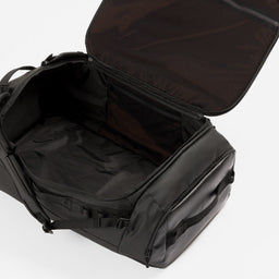 All Black duffel bag shown open, displaying its spacious interior and exterior design against a clean white background.