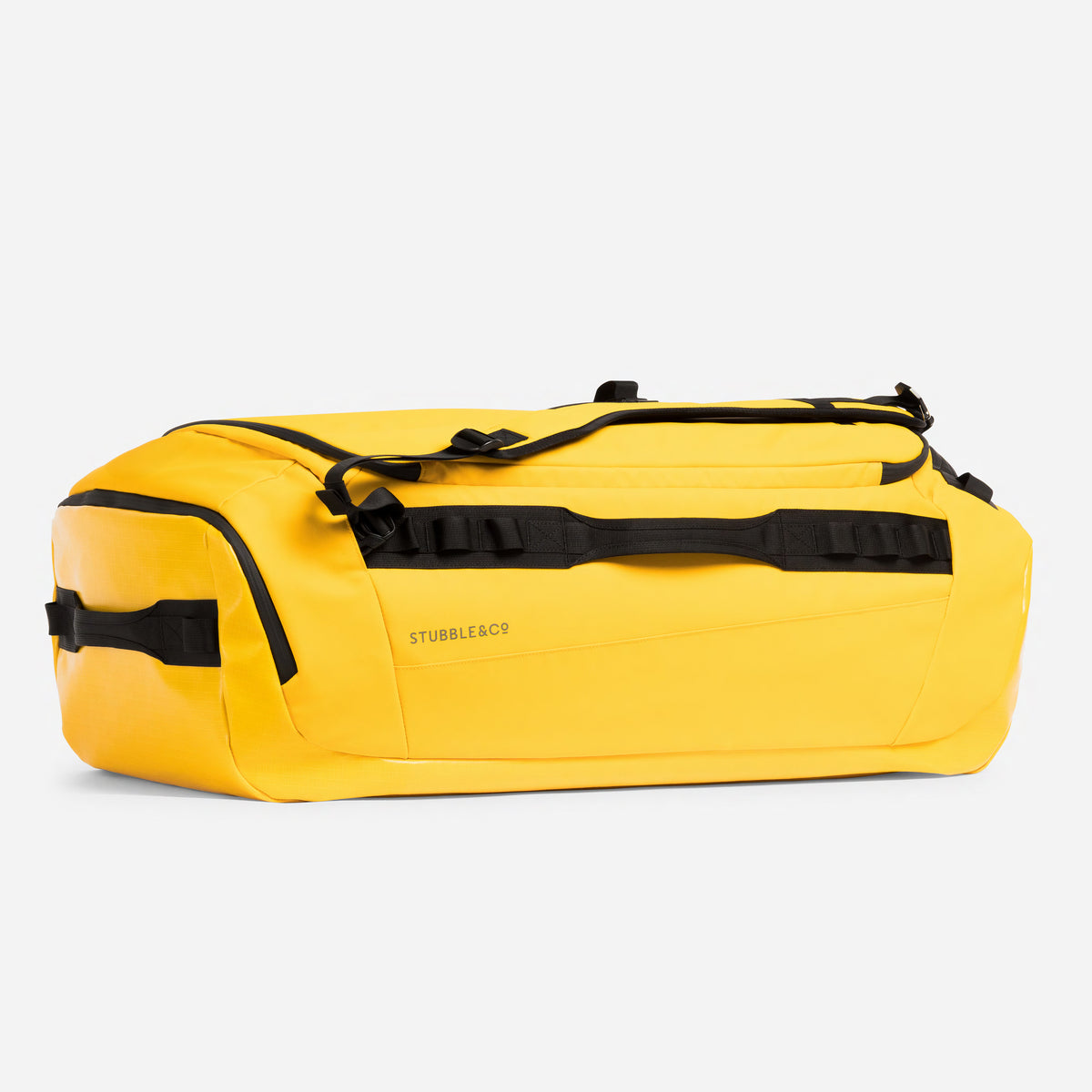 Yellow waterproof duffel bag with black straps and trim, shown from a three-quarters angle on a light gray background.