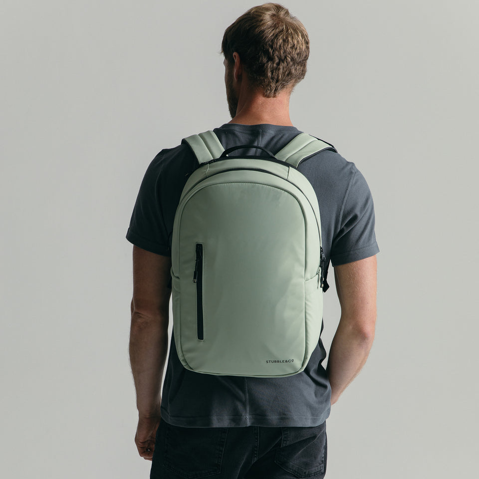 Model wearing the Everyday Backpack in Matcha