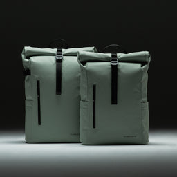 Front view of the Roll Top and Roll Top Mini Backpacks side by side in Matcha green