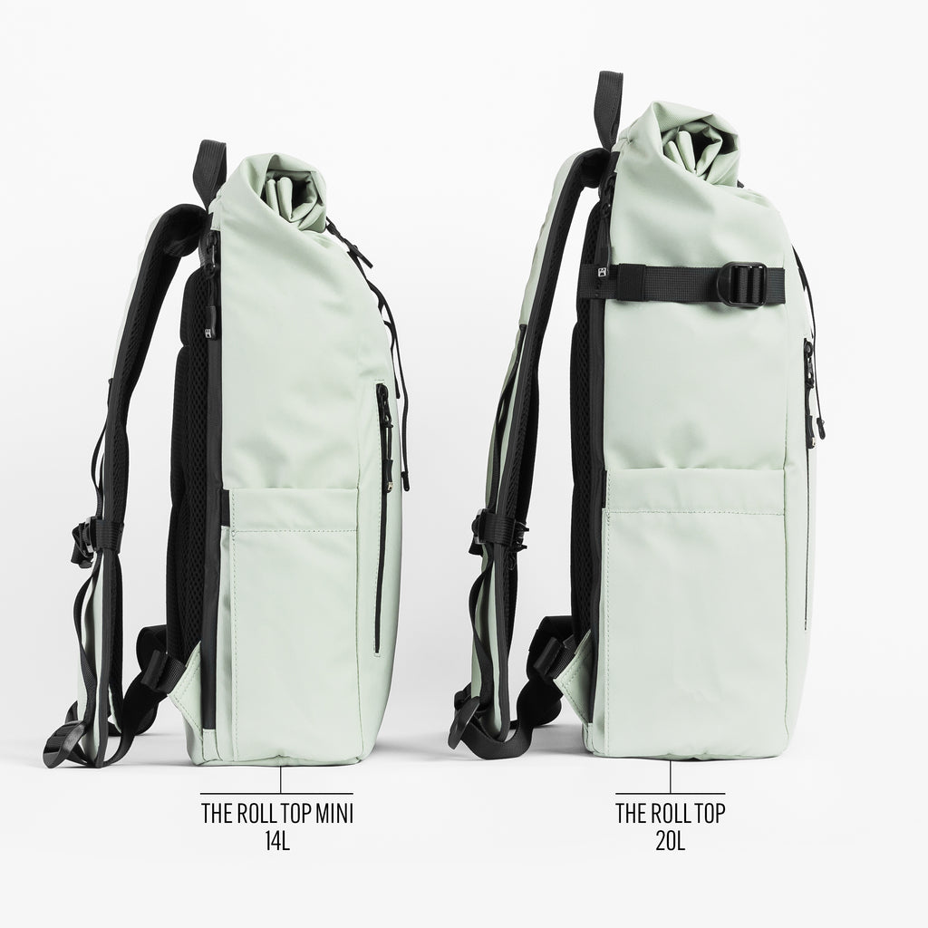 Side by side size comparison on the Roll Top and Roll Top Mini Backpacks in Matcha green