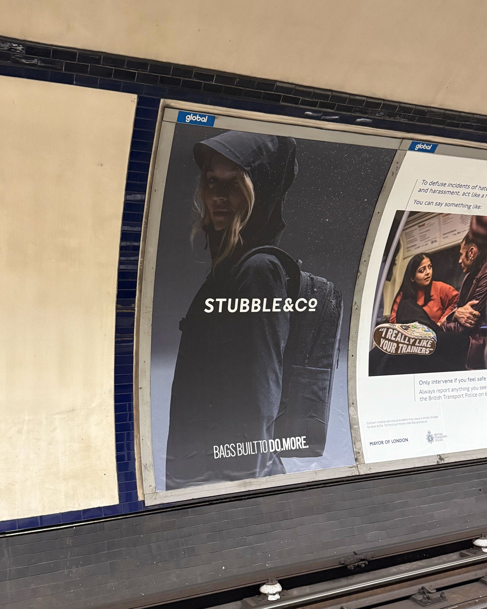 A wall panel in a London tube station with a Stubble & Co advert on the wall