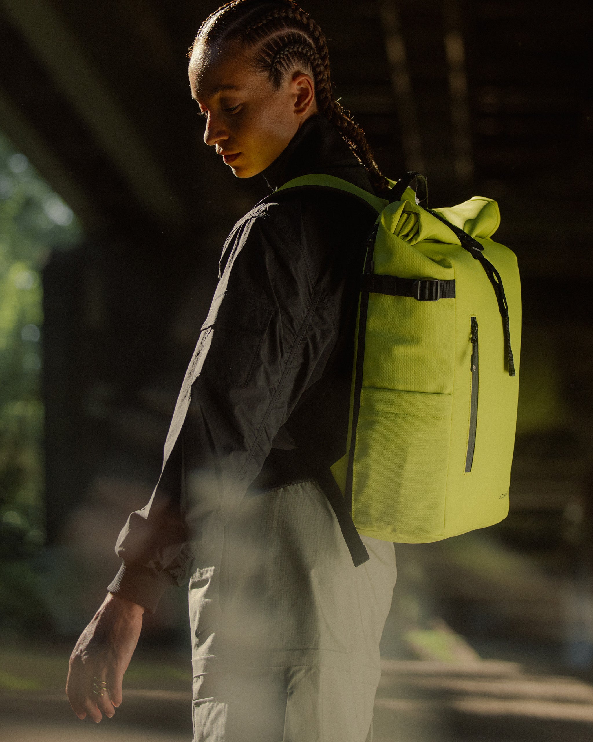 Person wearing a volt backpack in a natural setting