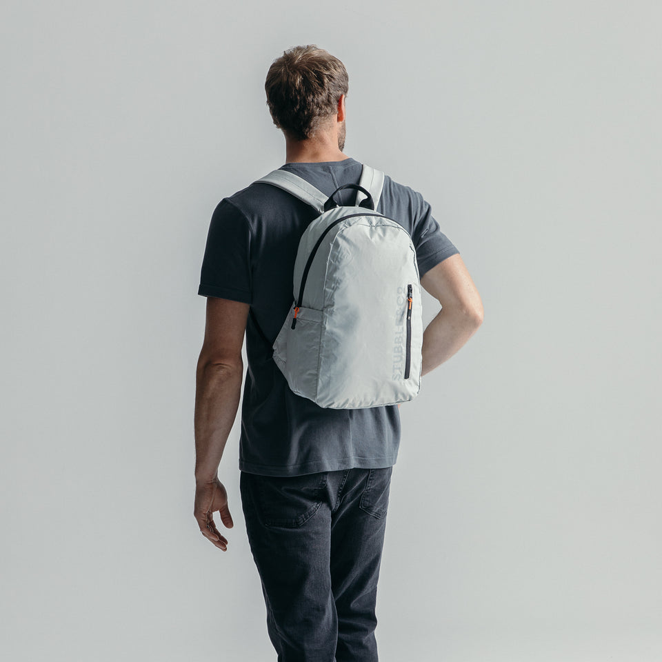 Man wearing the packable Off White Ultra Light Backpack