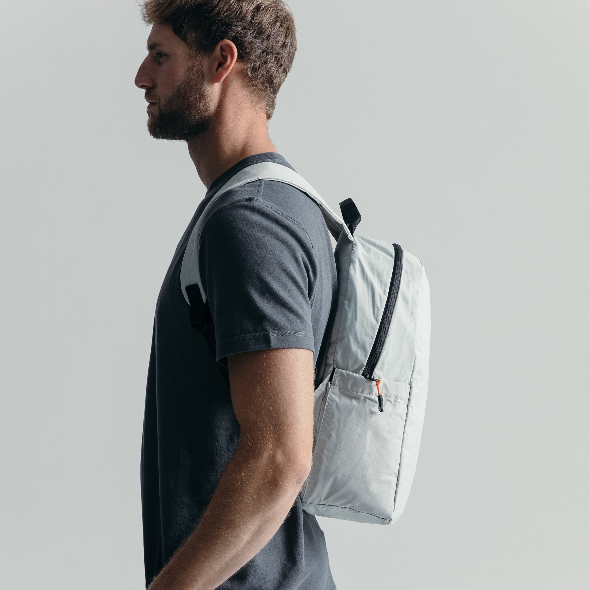 Man wearing the packable Off White Ultra Light Backpack