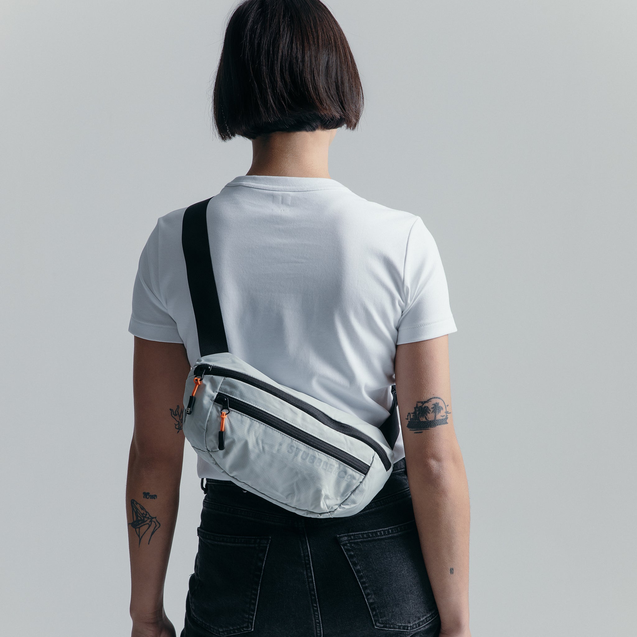Person wearing the Off White packable Ultra Light Crossbody Bag