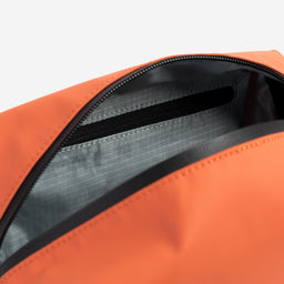 Recycled Plastic Wash Bag in Ember Orange close up open