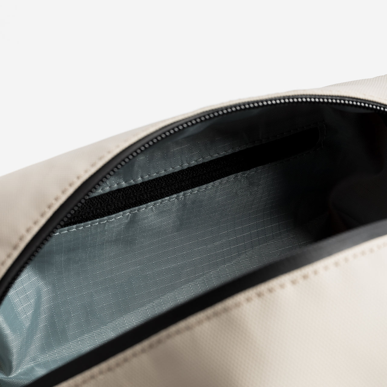 Close up of the Sand wash bag with zip open