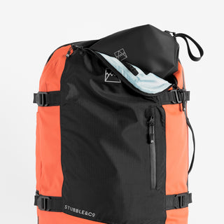 Front product shot of The Adventure Bag in Ember Orange with the a Wash Bag in the unzipped top pocket.