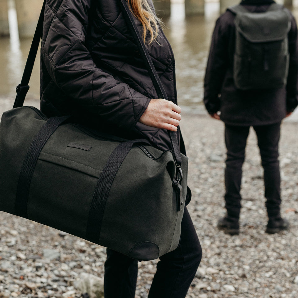 Women carries Weekender Duffle Bag
