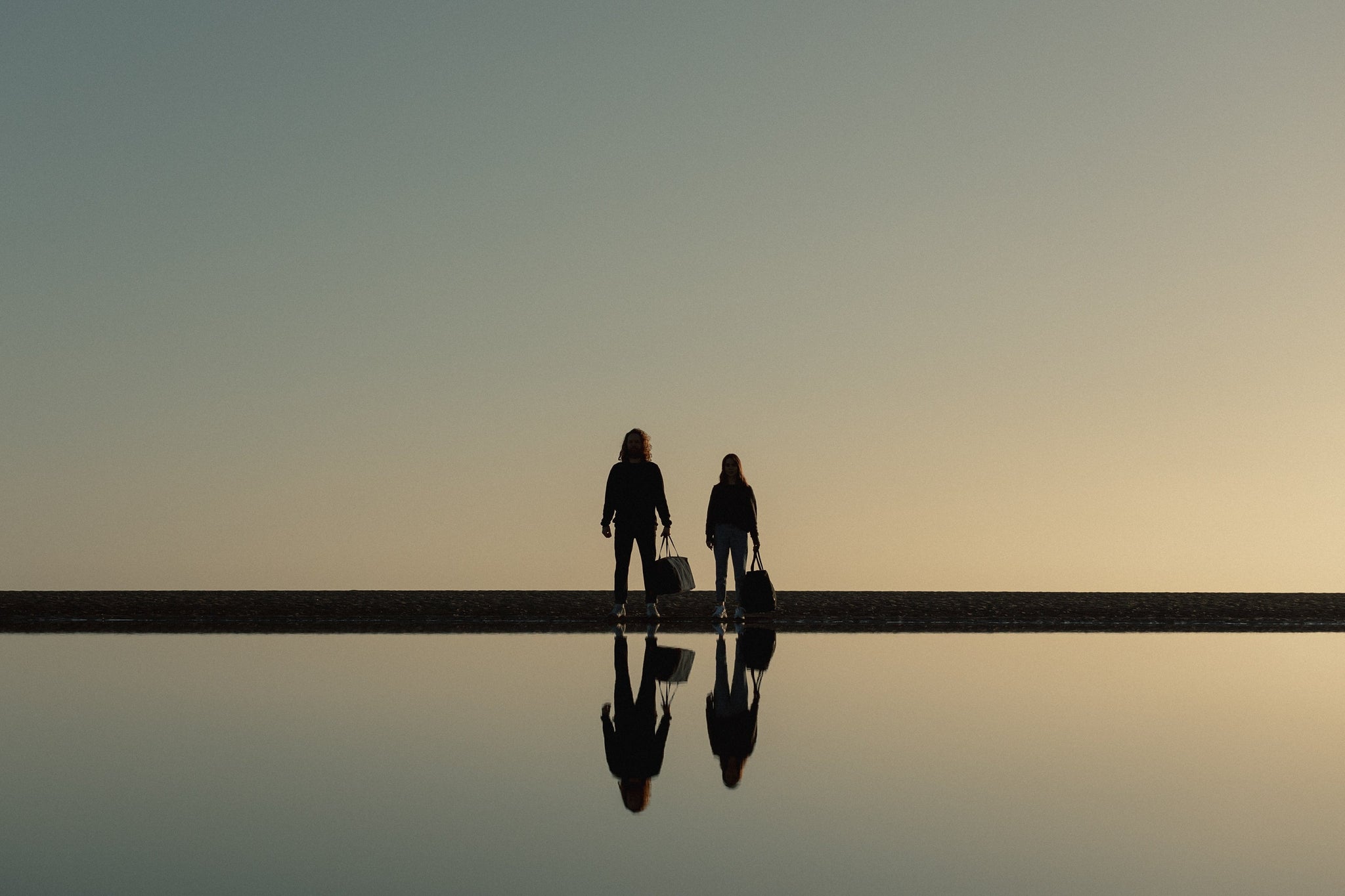 Man and women at night on a beach