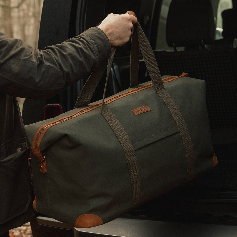 Weekender XL Duffle Bag being put into the boot of a car