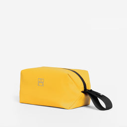 The Wash Bag in Yellow at a side angle