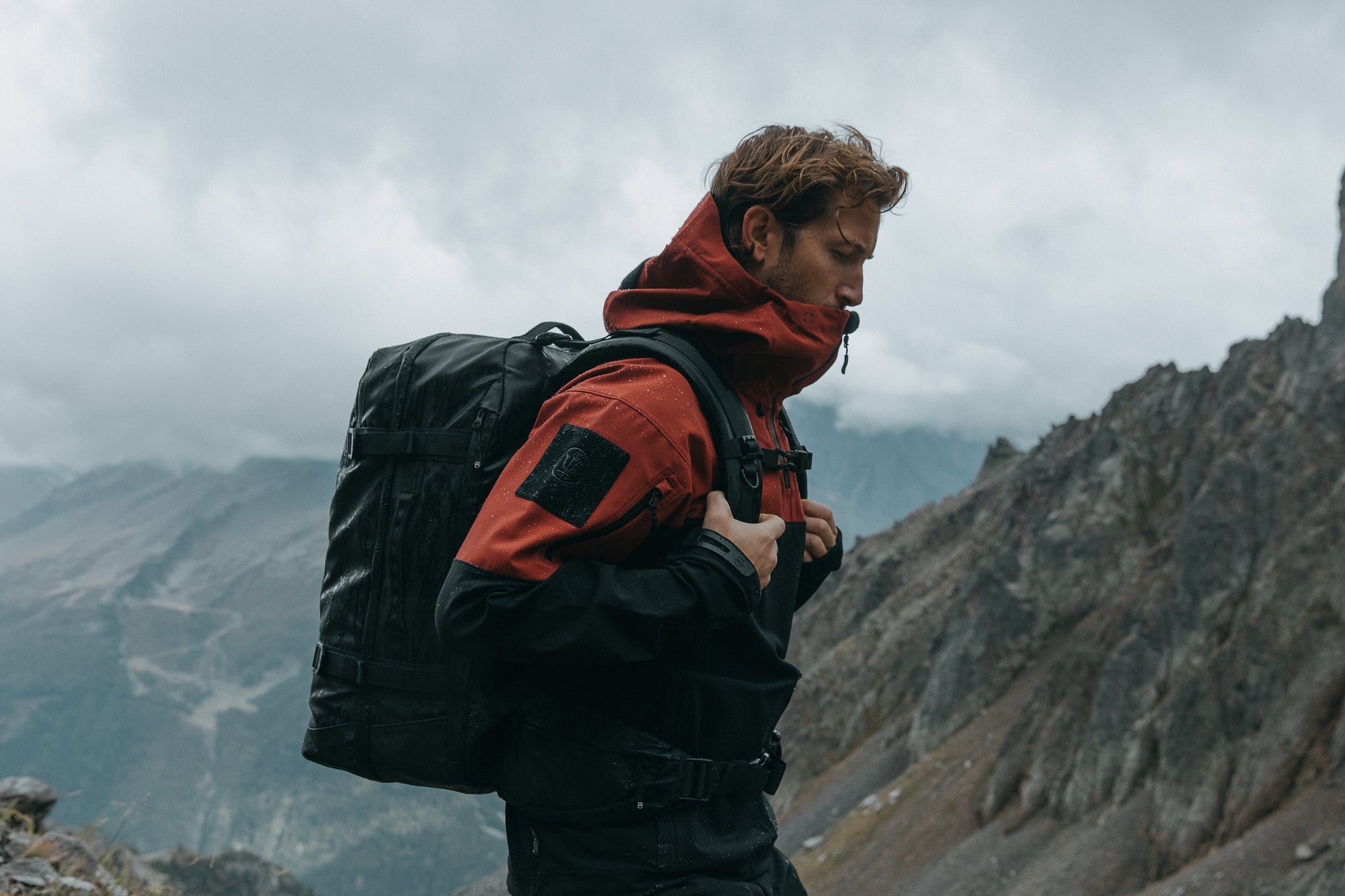 Man with backpack hiking mountain