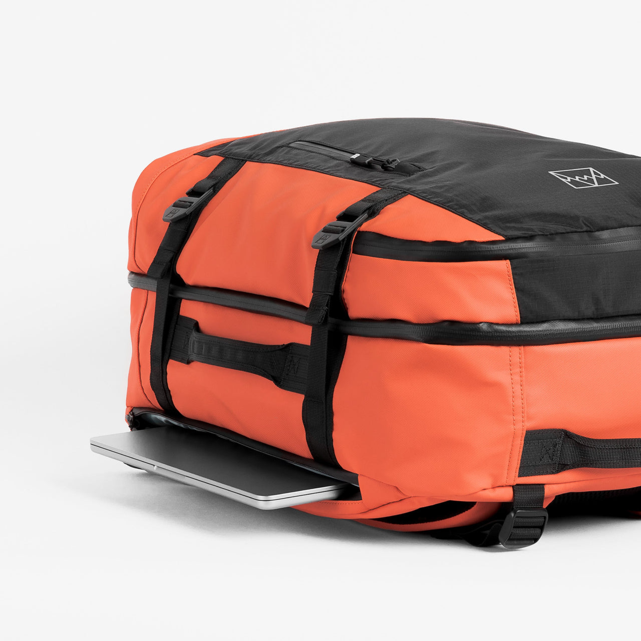 Adventure Bag in Ember Orange top view with laptop pocket open