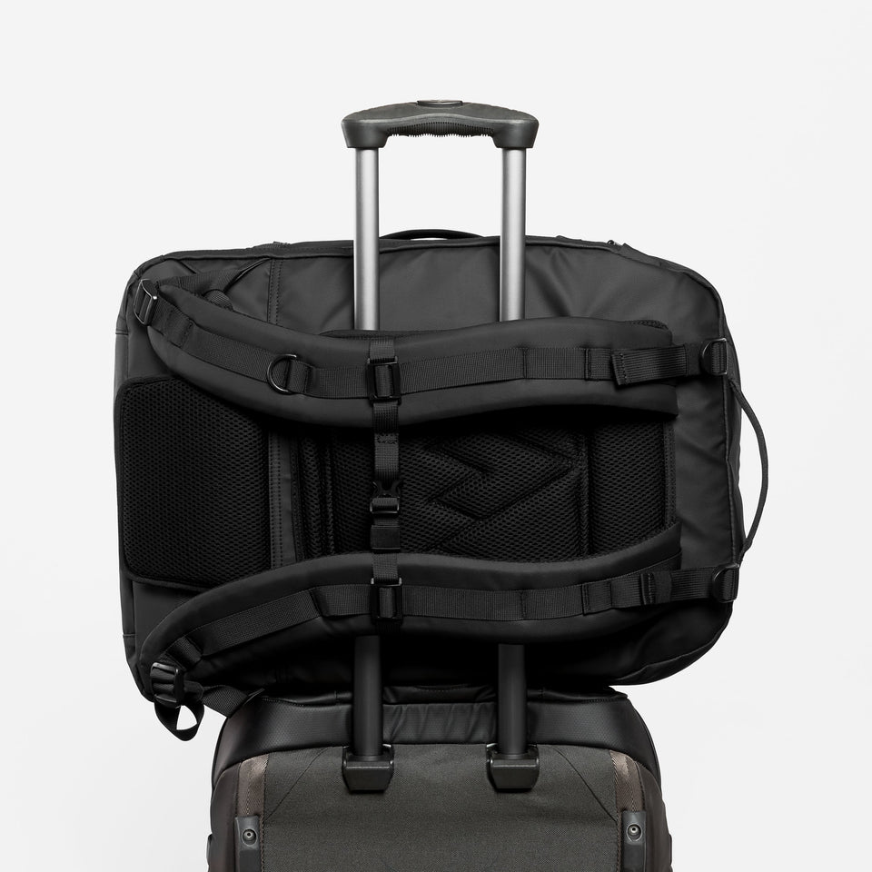 Adventure Bag in All Black with suitcase luggage sleeve