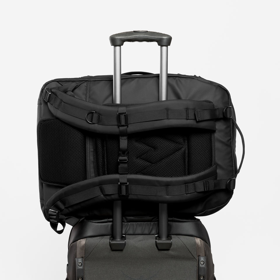 A studio shot of the back panel and trolley sleeve on a Tasmin Blue Adventure Bag